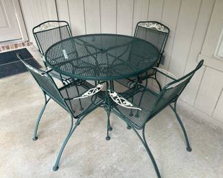Wrought iron vintage patio table and four chairs