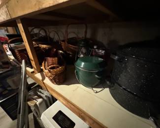 Large black white speckled stock pot, camping cooling and lighting, and a large collection of woven baskets at South Hadley Estate Sale in Massachusetts MA