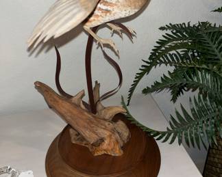 stuffed bird on stand