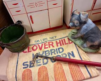 Vintage concrete pig "as is ears", primitive small green wood bucket and "Clover Hill" seed corn sack