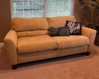 Mustard colored fabric sofa