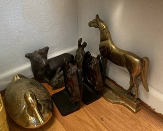 Antique iron and metal book ends, figurines, door stops, serving dishes, etc.