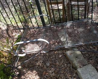 One of 2 metal mesh loungers