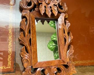 small wooden hand carved mirror