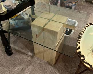 Retro glass-top coffee table with marble base.