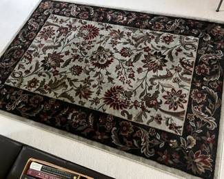 Area rug by Brooks Industries, 62” x 90”.