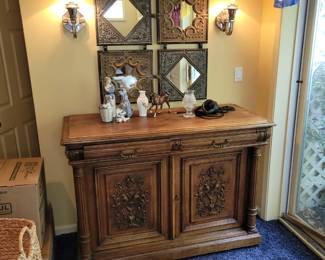 Carved front hall cabinet