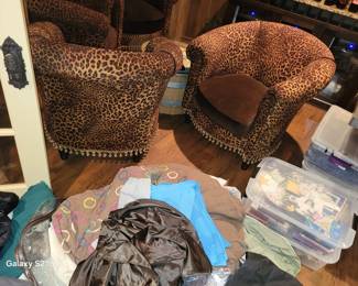 Leopard print upholstered club chairs