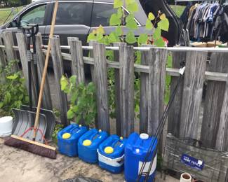 Snow shovels, pool chemicals & iron wrought hanging plant stakes 