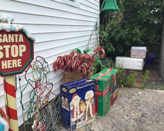 Outside Christmas decorations and inside mr & mrs. claus