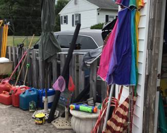 Umbrella, umbrella stands, gasoline cans