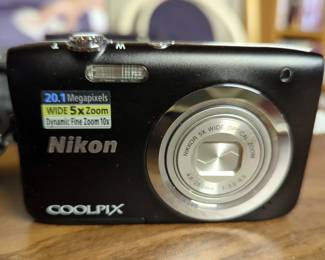 Nikon CoolPix A100 Digital Camera Including AC Adapter, Case And Starter Camera Kit