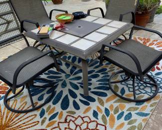 fire pit, swivel chairs, outdoor rugs