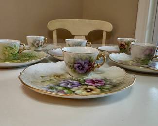 Uniquely matched hand painted luncheon plates and coffee cups.