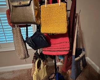 Rack full of handbags and purses.