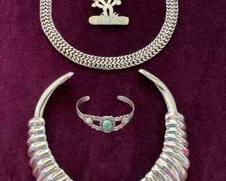 Mexican sterling pieces: heavy chain link necklace $250, cactus brooch $31, small Navajo sterling and turquoise bracelet $39, Mexican sterling necklace $250