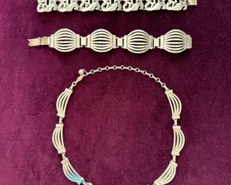 Sterling silver: arabesque pattern bracelet, Art Deco bracelet and matching necklace.
