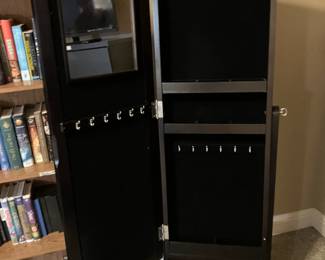 Mirror on stand with jewelry storage inside