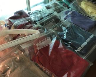 Lots of vintage sweaters, all individually bagged.