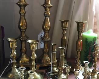 Lots of brass candlesticks, all sizes