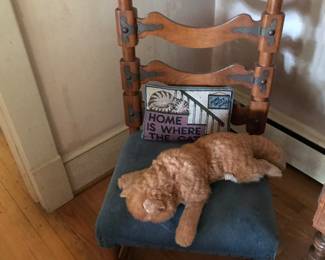 Vintage chair with a realistic cat