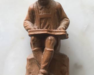 Carved dulcimer player 