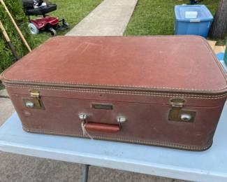Vintage suitcase, some damage.