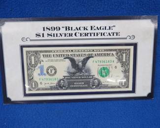 Lot 316. 1899 "Black Eagle" $1 Silver certificate&nbsp;overlayed on a modern $1.00 bill