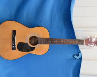 Lot 206. Omni guitar, 36" tall. VGC.