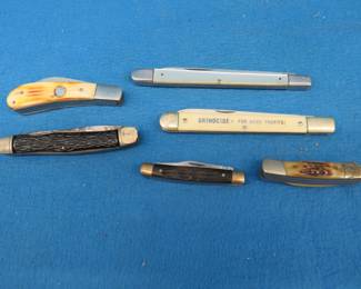 Lot 156. Six different knives including a Sabre and Camillus