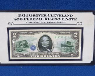 Lot 314. 1914 Grover Cleveland $20 Federal Reserve note overlayed on a modern $2 bill
