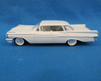Lot 465. Memory Models 1959 Pontiac Bonneville.&nbsp; Plastic promo dealer car.