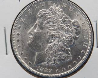 Lot 355. 1889 P Morgan silver dollar AU