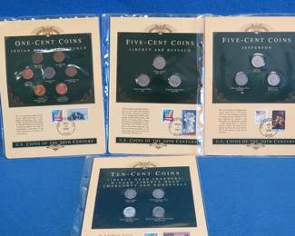 Lot 286. Four pages each featuring US pennies, nickels, or dimes and stamps
