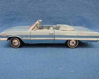 Lot 214. Welly 1963 Chevrolet Impala convertible.&nbsp; 1:18 scale die-cast car with box.