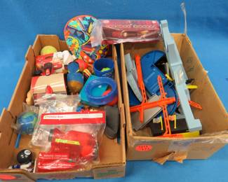 Lot 411. Two flats of promotional toys, race track, and more