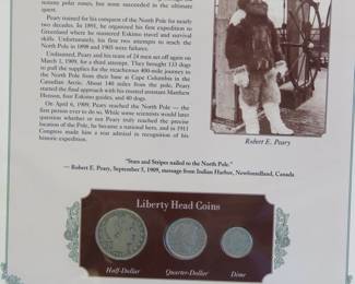 Lot 338. 1909 Liberty Head half, quarter and dime presented in a display that includes a historic photograph and historical comment.