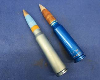 Lot 233. Two 30mm rounds