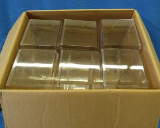 Lot 66. Box of six used plastic display boxes for die-cast cars in the original shipping box. 15 1/2" x 7" x 6".