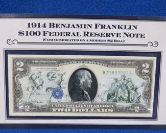 Lot 318. 1914 Benjamin Franklin $100 Federal Reserve note overlayed on a modern $2 bill
