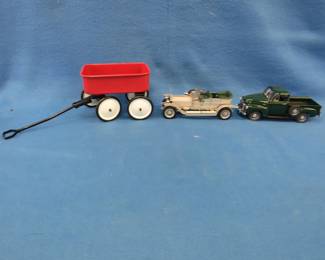 Lot 433. Danbury Mint 1950 Chevrolet pickup. 1:24 scale die-cast truck. Franklin Mint 1907 Rolls Royce Silver Ghost (no hood ornament) and a toy wagon.