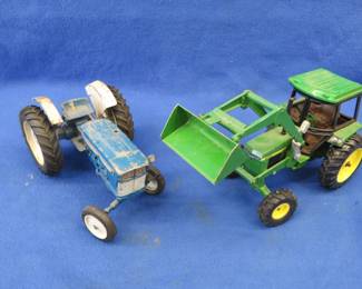 Lot 38. John Deere 2755 and a Ford 4000 die-cast tractors