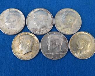 Lot 36. Six 1964 Kennedy silver half dollars