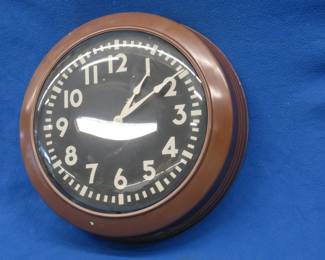 Lot 271. Battery-powered factory or school clock with domed-glass cover. We don't know if it works.