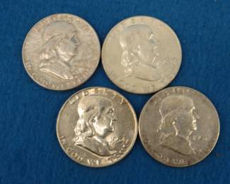 Lot 162. Four silver Franklin half dollars