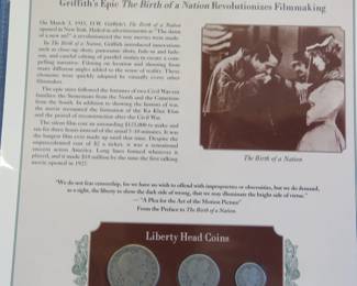 Lot 344. 1915 Liberty Head half, quarter and dime presented in a display that includes a historic photograph and historical comment.