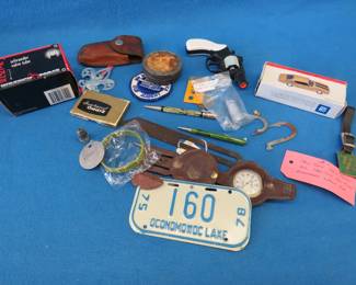 Lot 97. Collectible smalls including an enameled railroad watch fob, Remington watch, mechanical pencils, and more