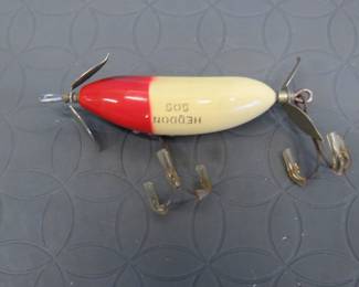 Lot 139. Vintage 2 5/8" Heddon wooden SOS injured minnow