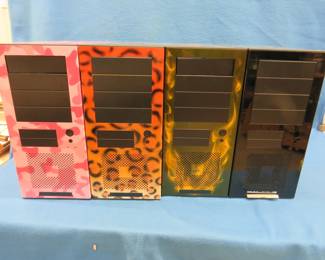 Lot 146. Four like-new air-brush-style computer tower frames.&nbsp; No internals.