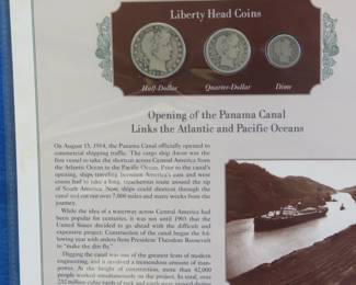 Lot 343. 1914 Liberty Head half, quarter and dime presented in a display that includes a historic photograph and historical comment.